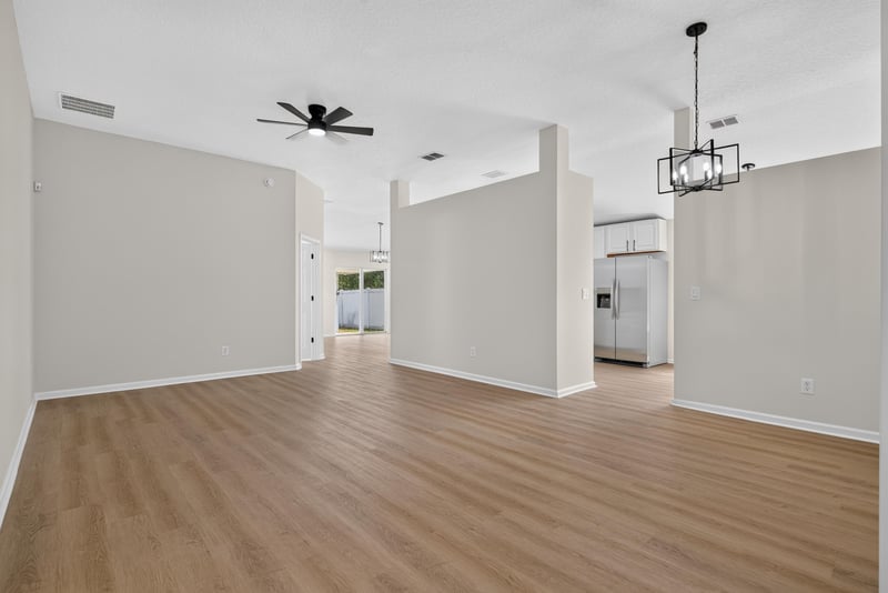 Living room, open floor plan, wood-look floors at 224 Pine Arbor Cir, St. Augustine, FL 32084