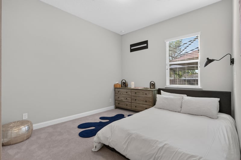 Bedroom with dresser and ceiling light at 3328 Southern Oaks Dr, Green Cove Springs, FL 32043