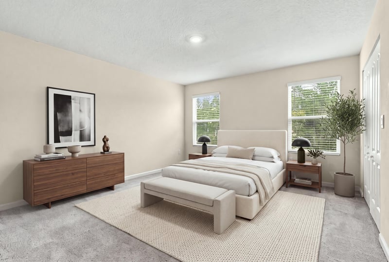 Staged bedroom with bed, dresser, and natural light at 9555 Star Dr, Jacksonville, FL 32256