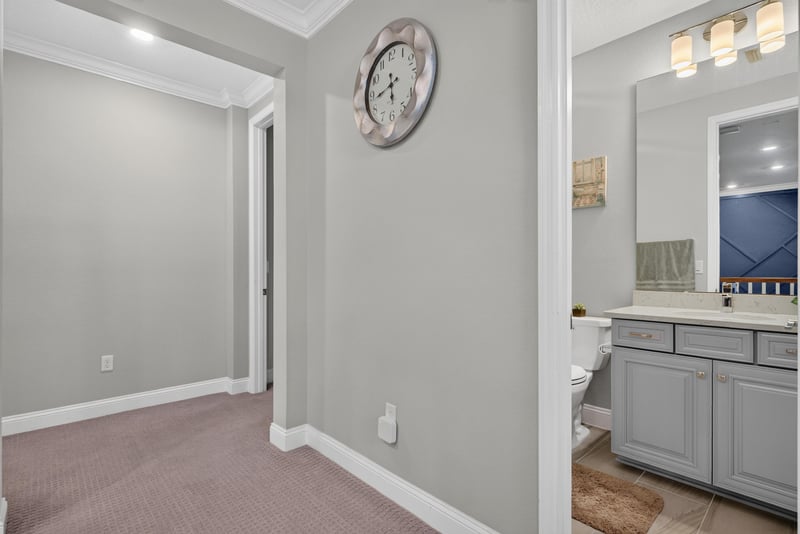 Hallway with carpet flooring at 22 Azura Point