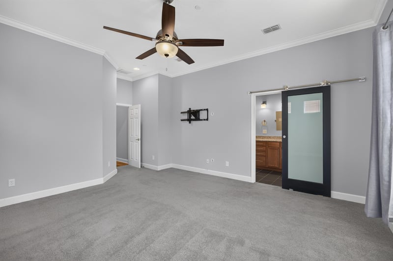 Upstairs room with glass door and ceiling fan at 6217 Eclipse Cir, Jacksonville, FL 32258