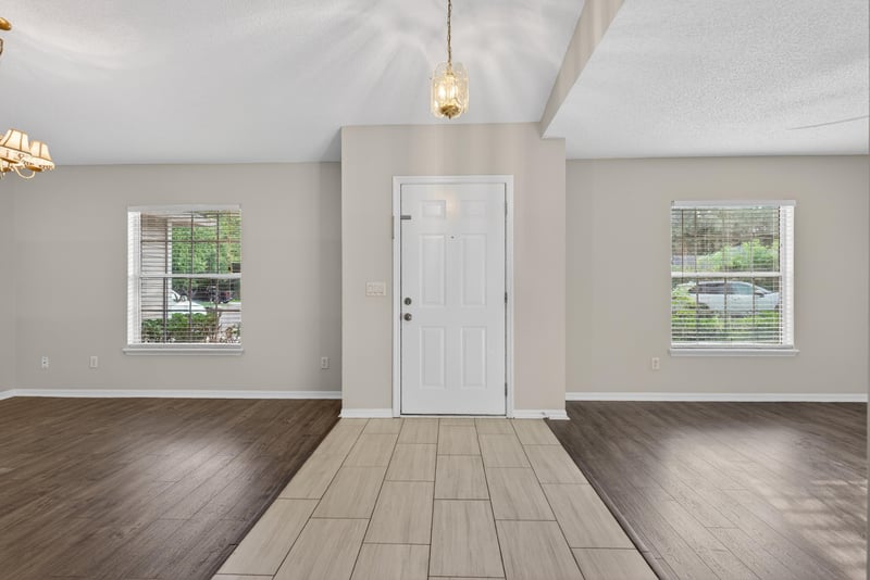 Entryway with wood-look flooring and front door at 1648 Glen Laurel Dr, Middleburg, FL 32068