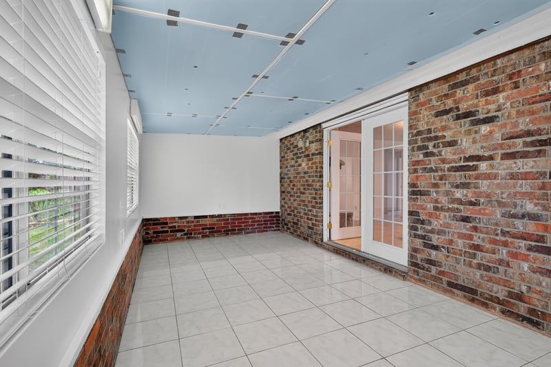 Florida room with french doors to backyard at 9954 Larkdale Ct, Jacksonville, FL 32257