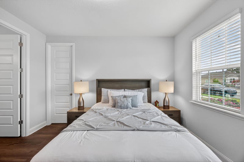 Bedroom with wood floors and window at 85491 Fall River Pkwy, Fernandina Beach, FL 32034
