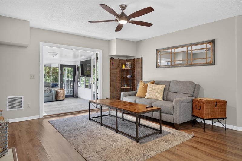Living room with sliding glass doors to patio at 8680 Bandera Cir S, Jacksonville, FL 32244