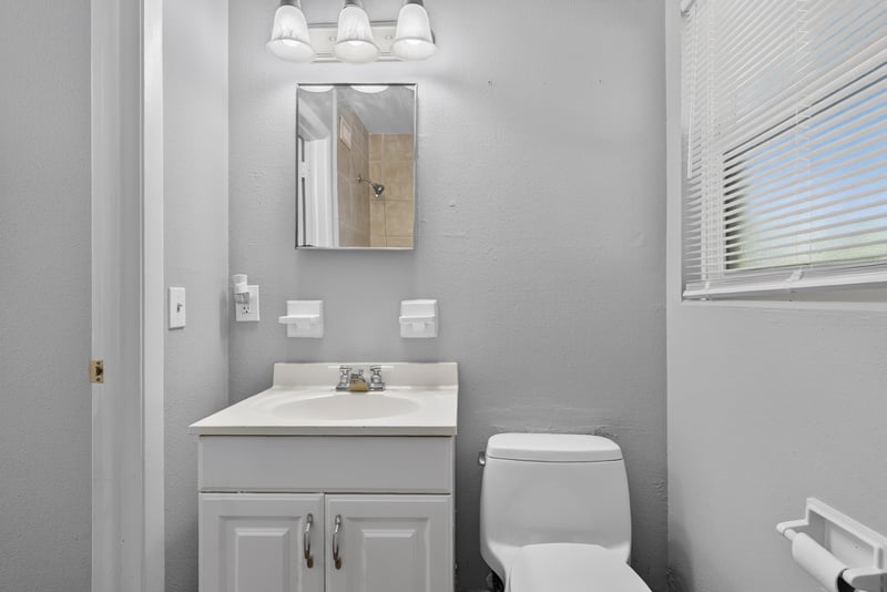 Bathroom vanity and toilet at 1928 Montmarte Dr, Jacksonville, FL 32210