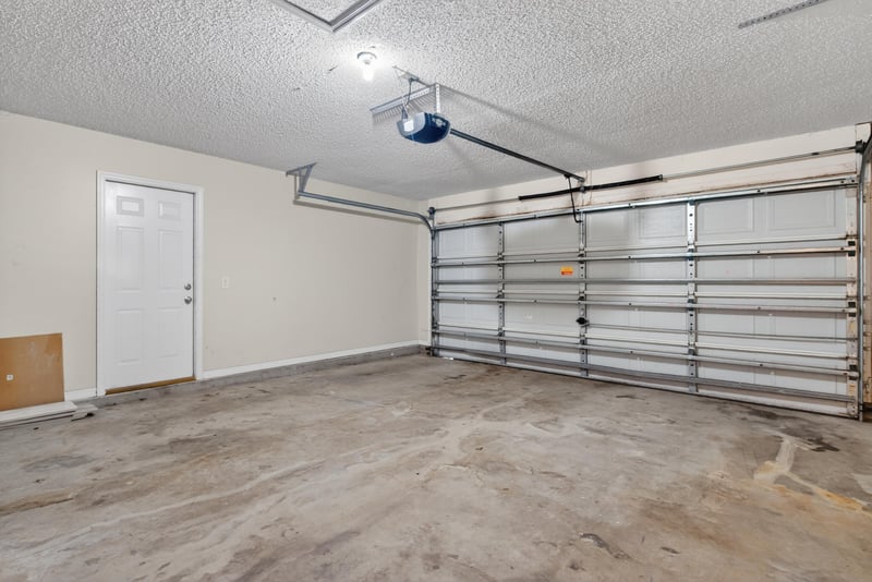 Two-car garage interior at 1648 Glen Laurel Dr, Middleburg, FL 32068