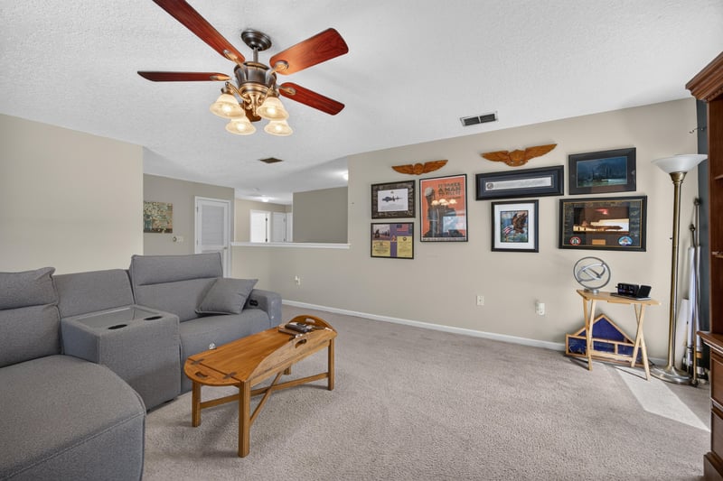 Bonus room with large sectional sofa at 3660 Middlebrook Dr, Orange Park, FL 32065