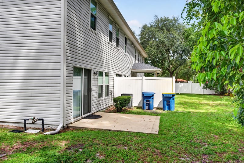 Backyard with fence and patio at 12359 Mangrove Forest Ct, Jacksonville, FL 32218