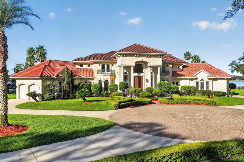 Front exterior with palm trees and side entry at 344 Broward Rd, Jacksonville, FL