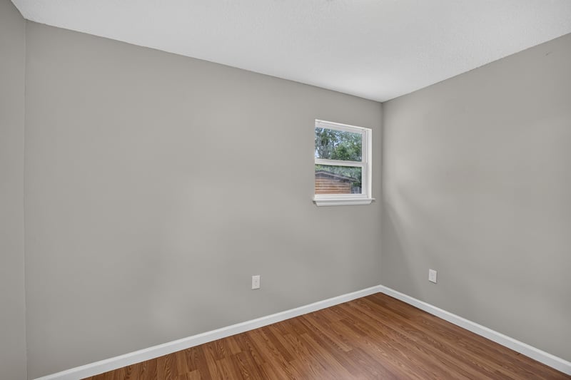 Empty room corner with window at 7015 Miss Muffet Ln N, Jacksonville, FL 32210