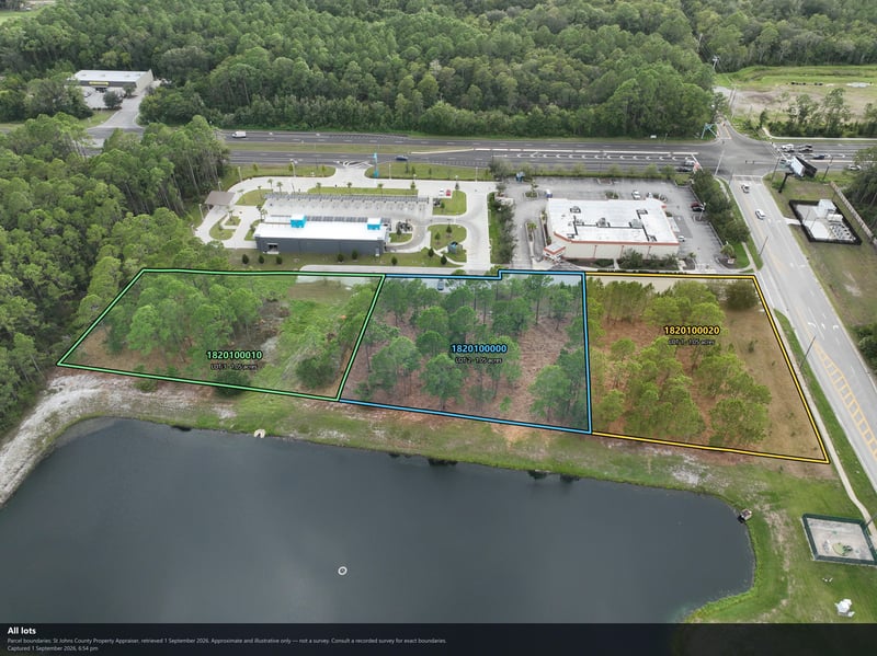 Aerial view of the pond and wooded parcel boundary at 4900 US-1, St. Augustine, FL 32086