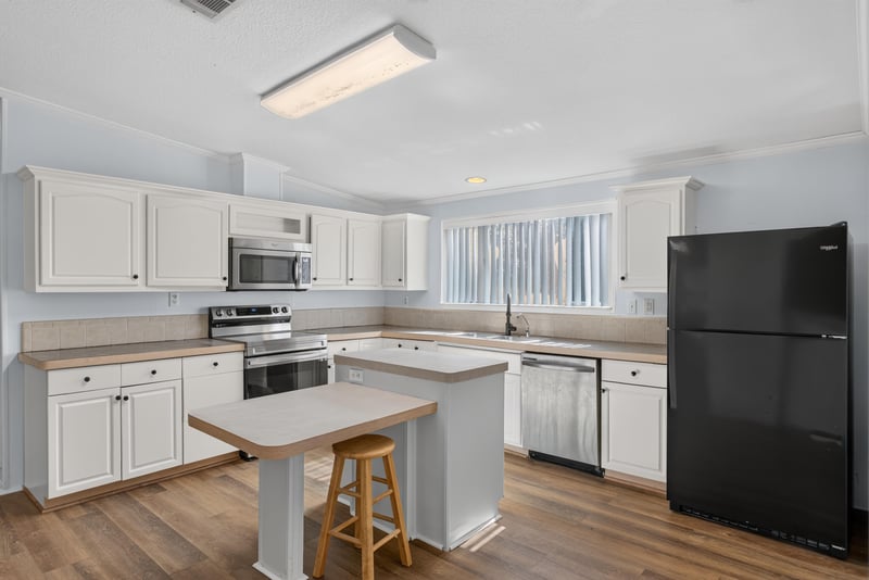Kitchen counter and cabinets with wood flooring at 3215 Robin Ln, Middleburg, FL