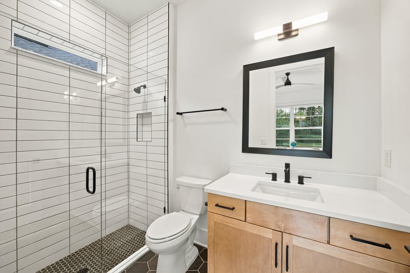 Bathroom with walk-in shower and window at 907 Seagrove Dr, Ponte Vedra Beach, FL 32081