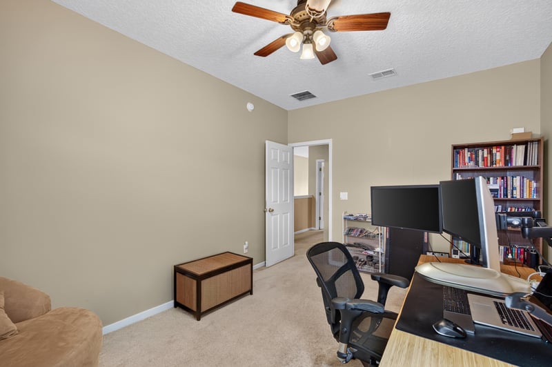 Office area with desks and computer monitors at 2875 Pebblewood Ln, Orange Park, FL 32065