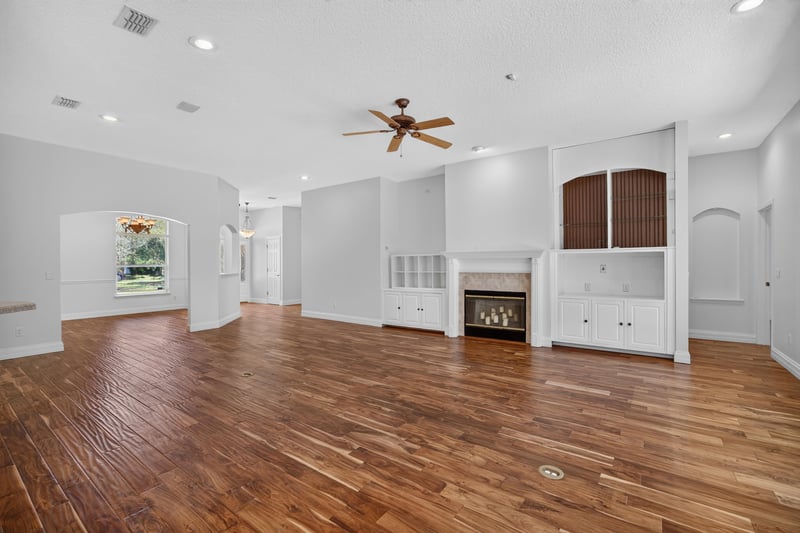 Living room with fireplace and built-in cabinetry at 11675 Magnolia Estates Rd, Jacksonville, FL 32223