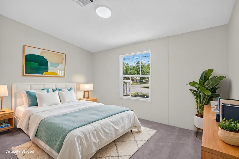 Bedroom staged with bed and artwork at 7603 Coach Park Dr, Jacksonville, FL 32244