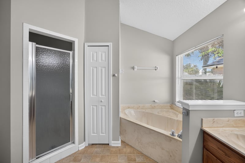 Bathroom with shower stall and soaking tub at 14147 Fish Eagle Dr E, Jacksonville, FL 32226