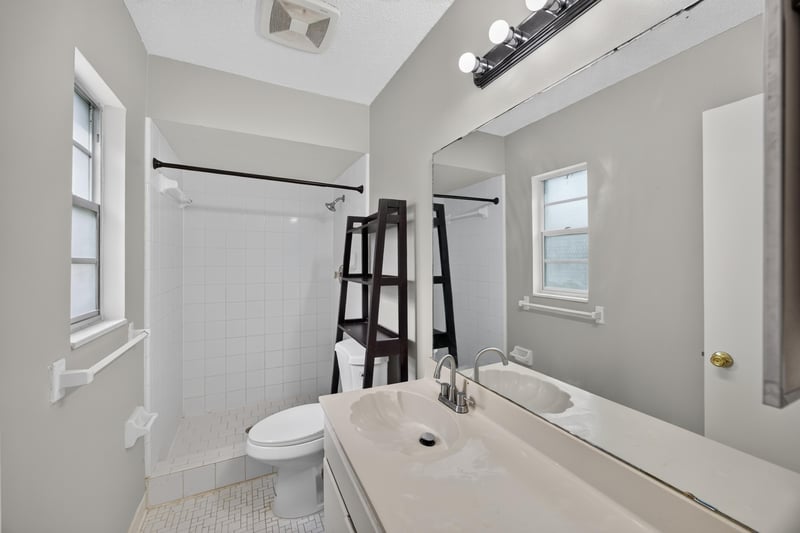Bathroom with step-in shower and vanity at 12351 Condor Dr