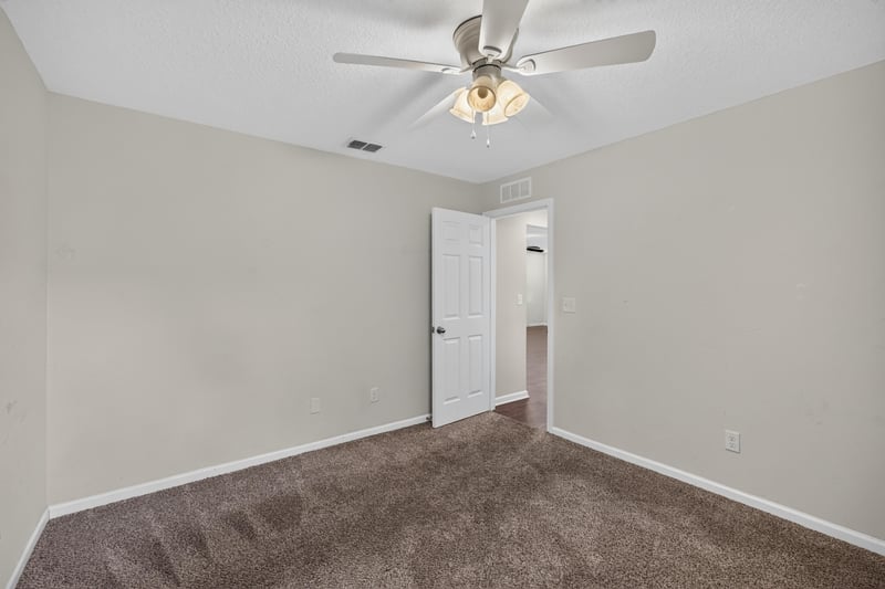 Empty bedroom with carpet and ceiling fan at 1002 Ingleside Ave, Jacksonville, FL 32205