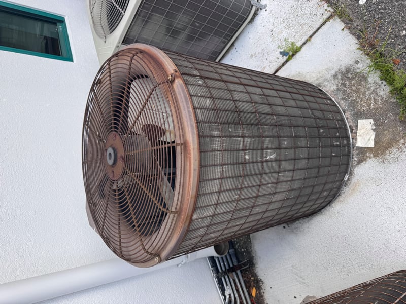 Rusted fan cage on older condenser unit at 11700 New Kings Rd, Jacksonville, FL 32219
