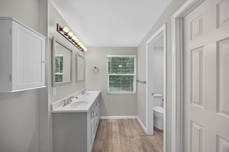 Bathroom, double sink vanity and framed mirror at 2256 Inwood Cir S, Jacksonville, FL