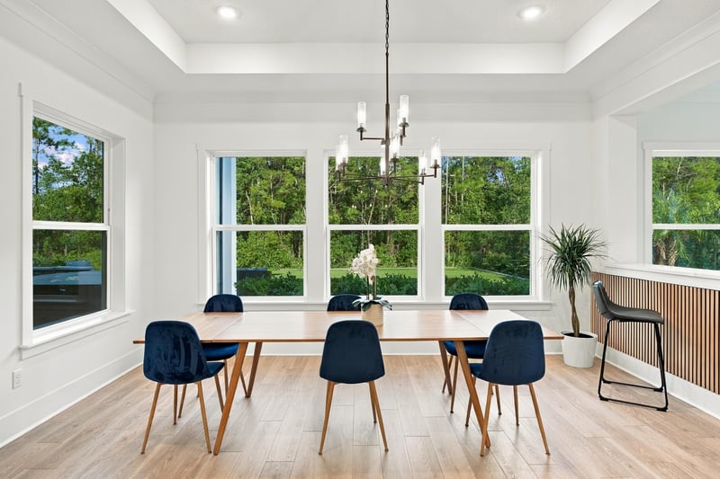 Dining room with table and tall windows at 907 Seagrove Dr, Ponte Vedra Beach, FL 32081