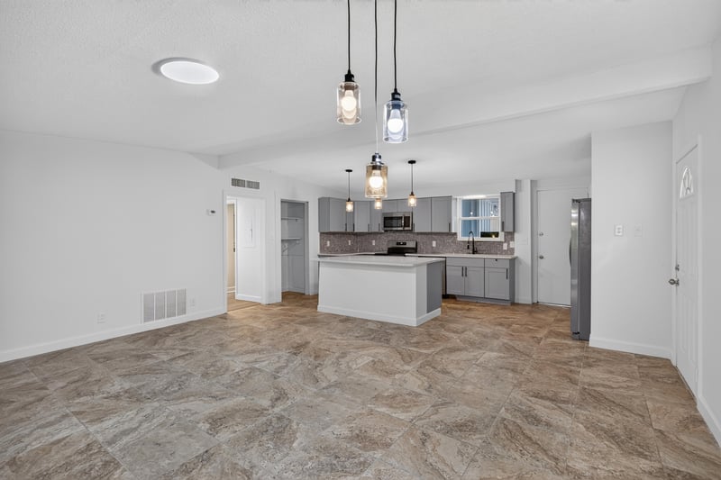 Kitchen with gray cabinets and center island at 3113 Kline Rd, Jacksonville, FL 32246