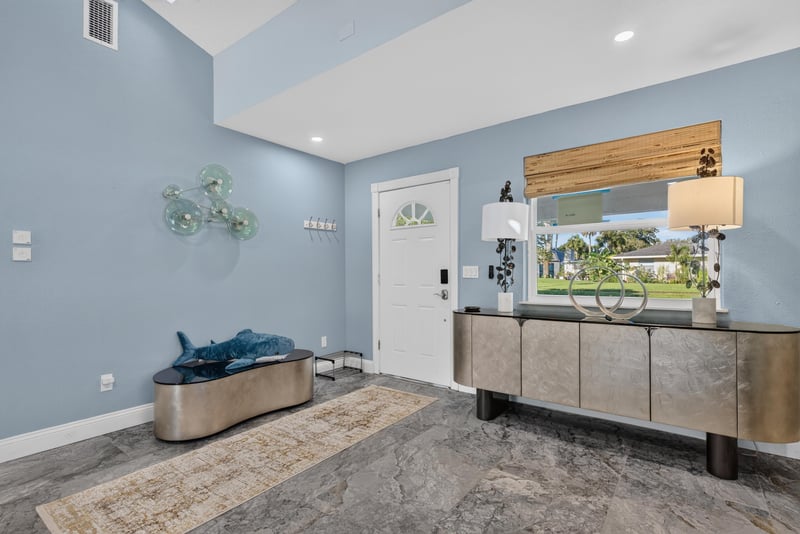 Foyer with bar cabinet and wall art at 1525 8th St N, Jacksonville Beach, FL