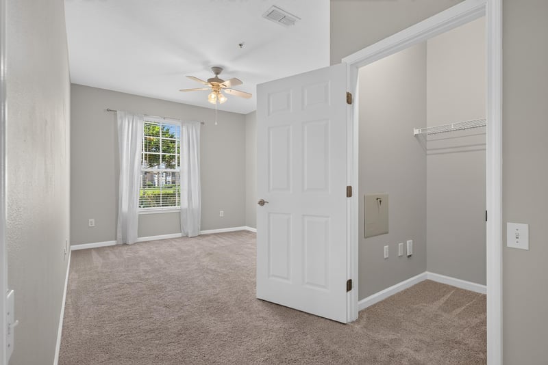 Bedroom with closet and window at 7990 Baymeadows Rd E #404, Jacksonville, FL 32256