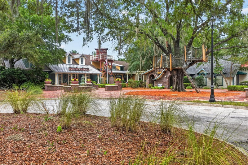 Community clubhouse entrance with brick walkway in Oakleaf Plantation