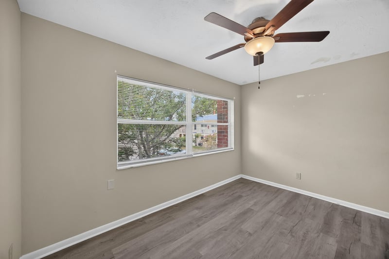 Bedroom with wood-look flooring and ceiling fan at 2658 Trollie Ln apt 1, Jacksonville, FL 32211