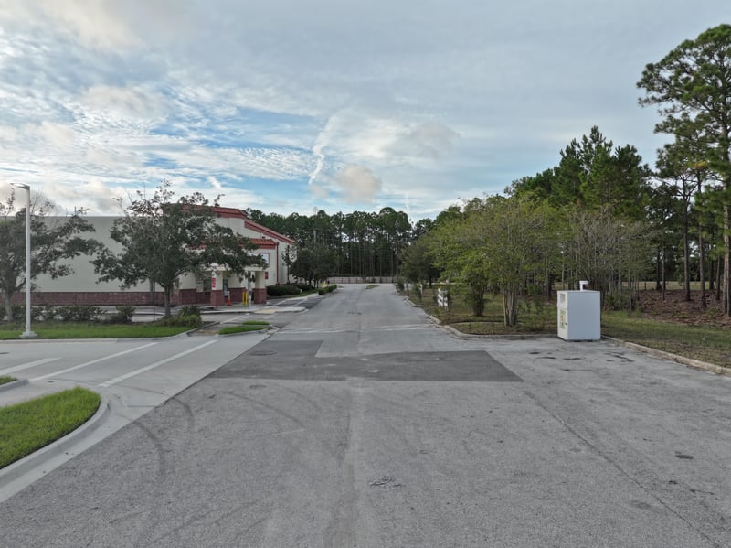 Ground-level view of the access road beside the parcel at 4900 US-1, St. Augustine, FL 32086