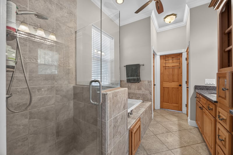 Primary bath shower with glass enclosure at 1735 Hagans Ridge Ct