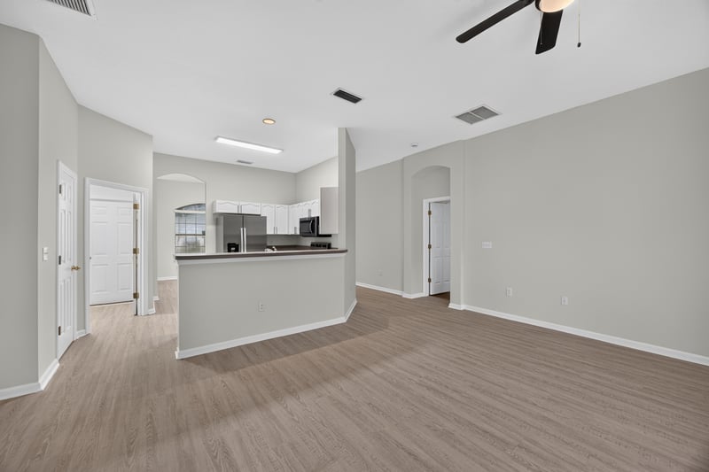 Kitchen with island and white cabinets at 706 Bonaparte Dr, Jacksonville, FL 32218
