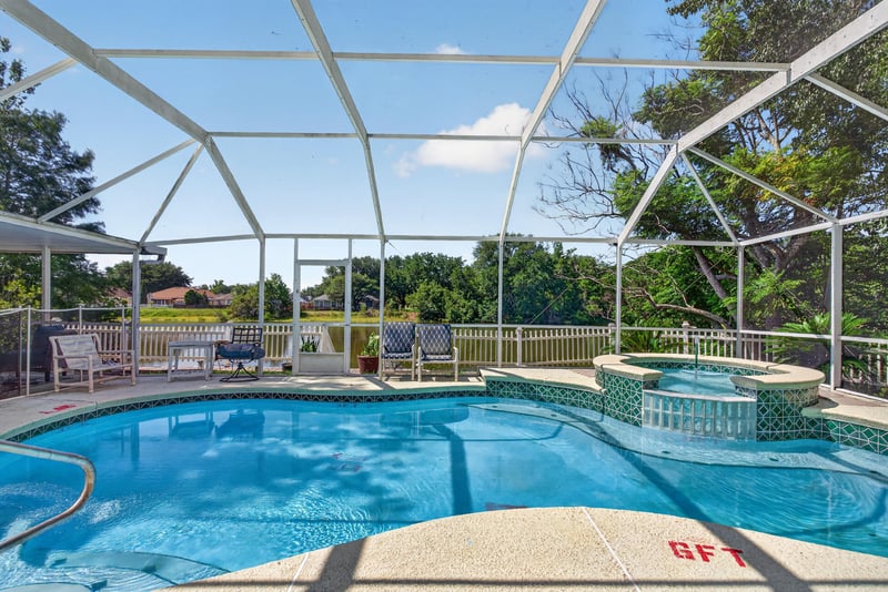 Screened pool with surrounding lanai at 8680 Bandera Cir S, Jacksonville, FL 32244