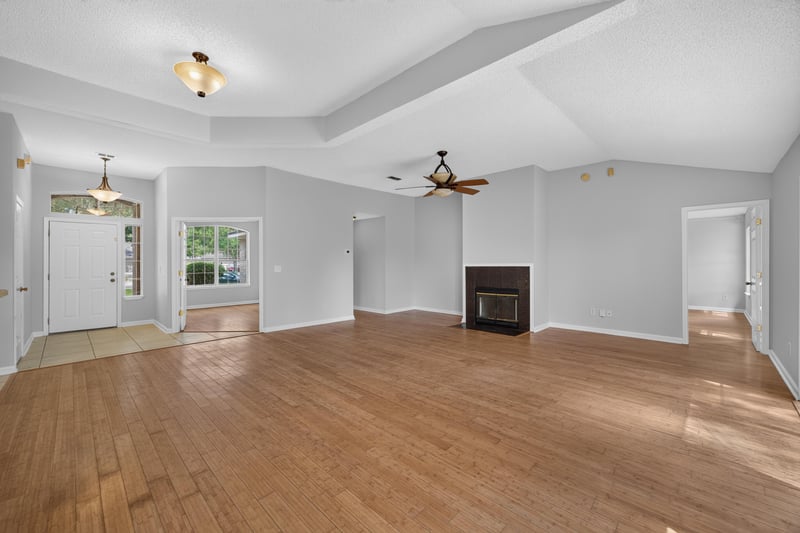 Living room with fireplace and wood flooring at 456 Bay Point Way N, Jacksonville, FL 32259