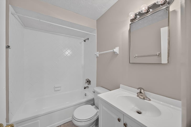 Bathroom with tub shower and mirror at 1143 Tumbleweed Dr, Orange Park, FL 32065