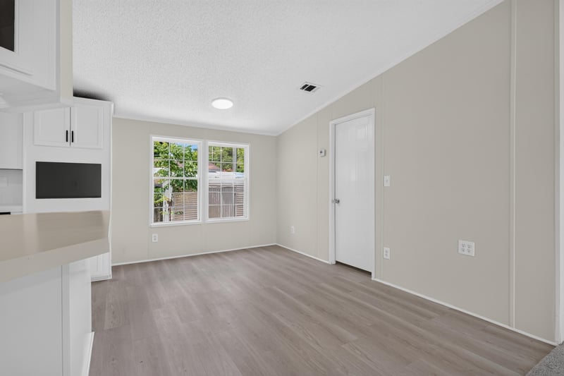 Living area with microwave and doorway at 7603 Coach Park Dr, Jacksonville, FL 32244