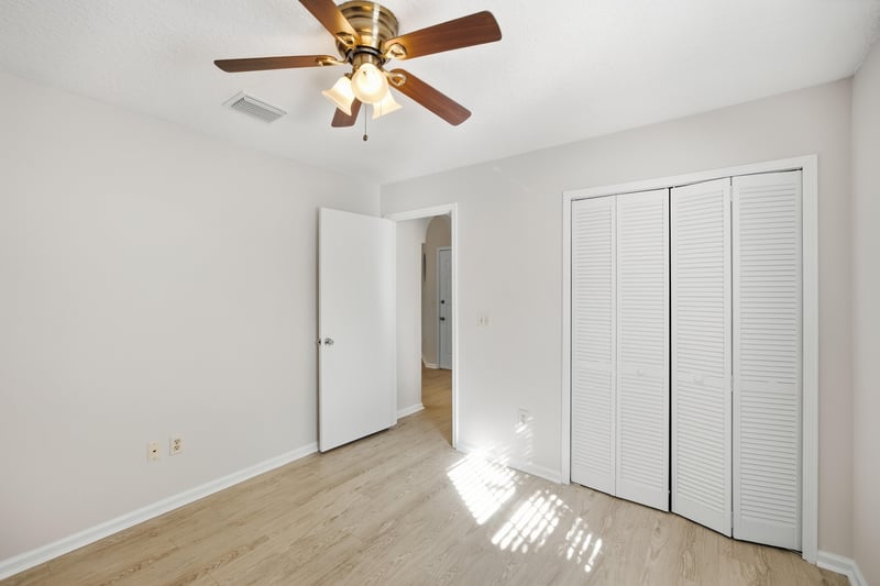 Bedroom with closet and ceiling fan at 678 5th Ave N, Jacksonville Beach, FL 32250