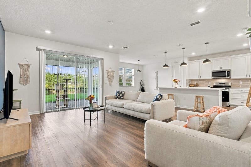 Living room with sliding doors to patio, photographed by Megapixeler on Torres Trace, St. Augustine