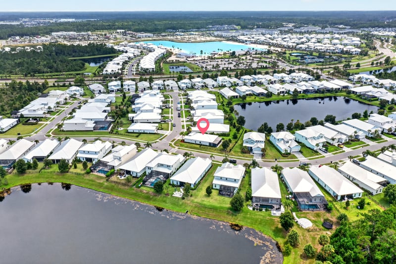 Aerial view of Beachwalk in St. Johns, FL, with 91 Tilloo Ct pinned between two ponds and the lagoon beyond