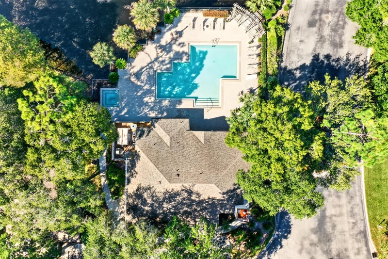 Aerial view of swimming pool and condo buildings in Jacksonville, FL