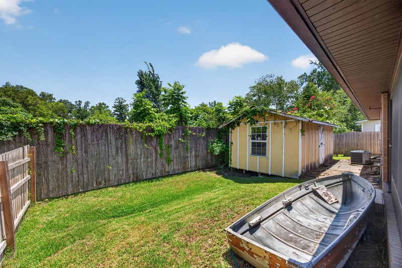 Backyard with fenced yard, boat, and shed at 2460 San Sago Ln, Jacksonville, FL