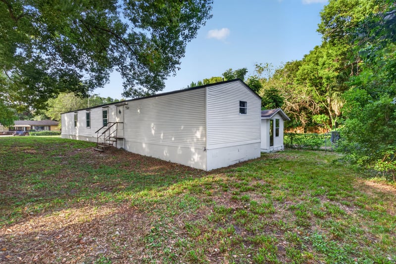 Rear exterior with wooded yard at 4565 Appleton Ave, Jacksonville, FL