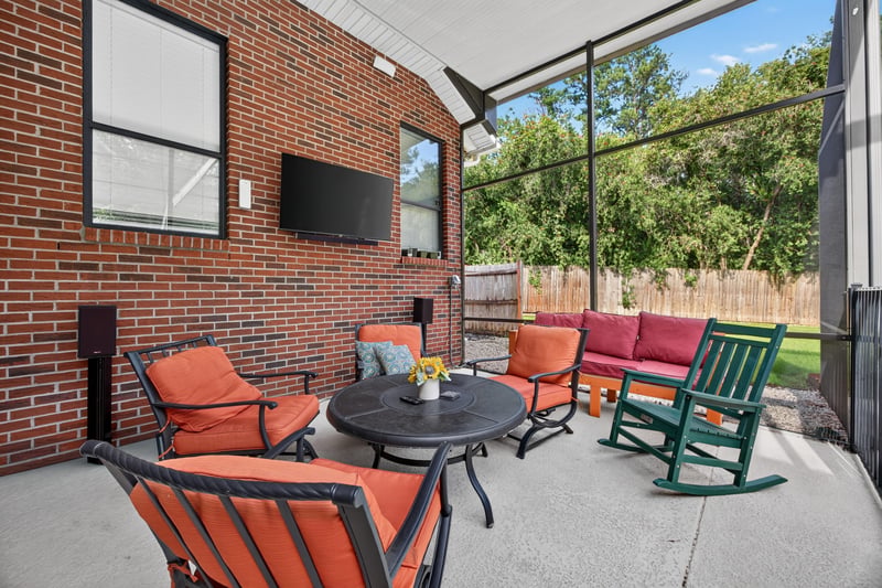 Covered patio with outdoor seating at 2125 Blue Heron Cove Dr, Orange Park, FL 32003