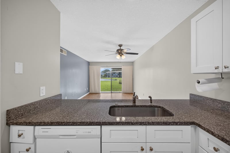 Dining area with window and ceiling fan at 700 W Pope Rd unit h61, St. Augustine, FL 32080