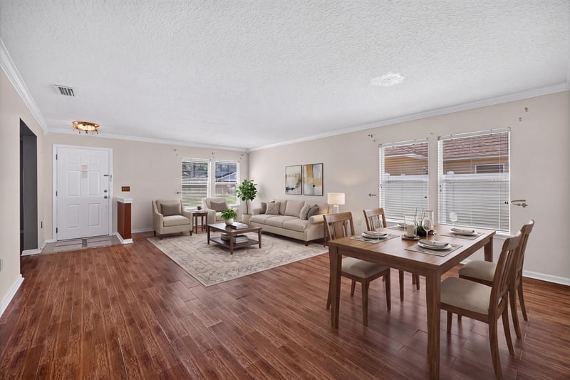Virtually staged living and dining combo at 2282 Justin Lake Dr, Jacksonville, FL