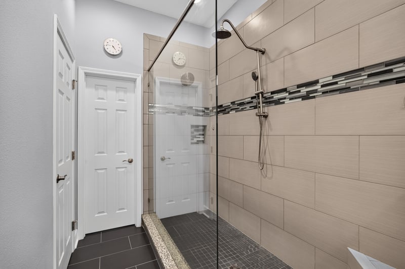 Primary bathroom shower with tile surround at 6217 Eclipse Cir, Jacksonville, FL 32258
