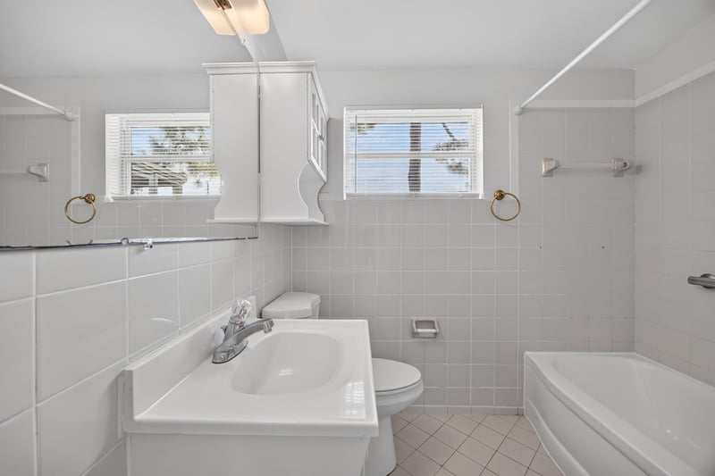 Bathroom sink with window above at 87 Saratoga Cir S, Atlantic Beach, FL